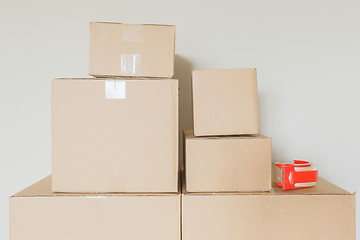 Image showing Variety of Packed Moving Boxes In Empty Room