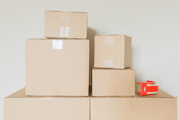 Image showing Variety of Packed Moving Boxes In Empty Room