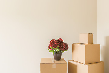 Image showing Variety of Packed Moving Boxes In Empty Room