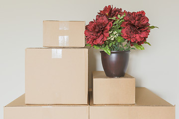 Image showing Variety of Packed Moving Boxes In Empty Room