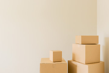 Image showing Packed Moving Boxes In Empty Room