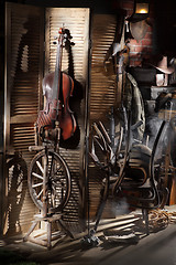 Image showing Still Life With Old Cello And Spinning Wheel