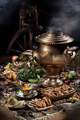 Image showing Still Life With Samovar, Fruits, Tea And Spinning Wheel