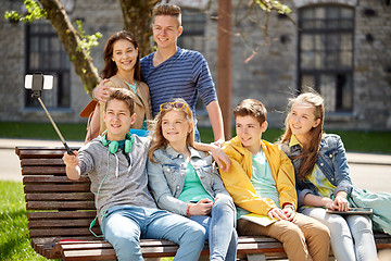 Image showing happy teenage students taking selfie by smartphone