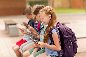 Image showing group of happy elementary school students talking