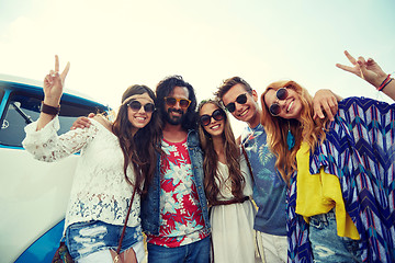 Image showing hippie friends over minivan car showing peace sign