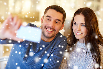 Image showing couple taking smartphone selfie at cafe restaurant