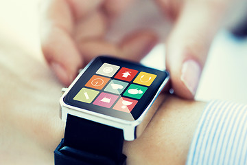 Image showing close up of hands setting smart watch application