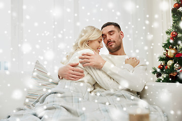 Image showing happy couple at home with christmas tree