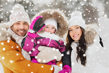 Image showing happy family waving hands outdoors in winter