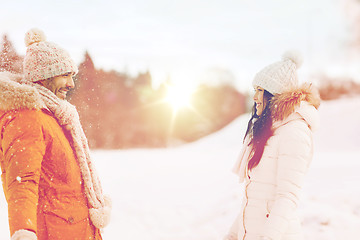 Image showing happy couple walking over winter background