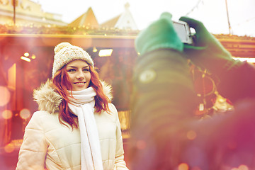 Image showing couple taking picture with camera in old town