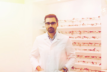 Image showing man optician in glasses and coat at optics store