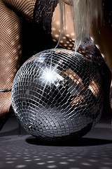 Image showing fishnet stockings and disco ball