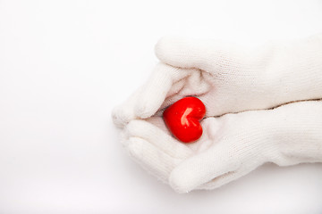 Image showing Woman hands in white gloves holding heart symbol