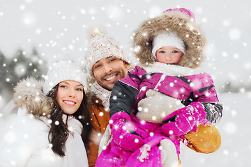 Image showing happy family with child in winter clothes outdoors