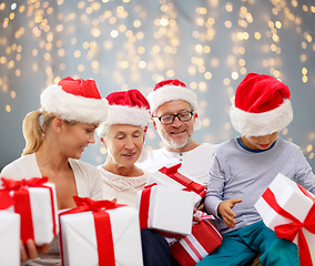 Image showing happy family sitting on couch at home