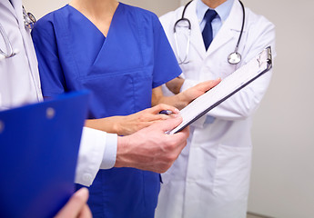 Image showing close up of doctors with clipboard at hospital