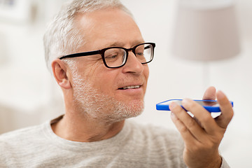 Image showing old man using voice command recorder on smartphone