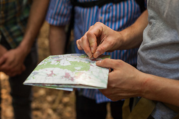 Image showing Navigating with map and compass