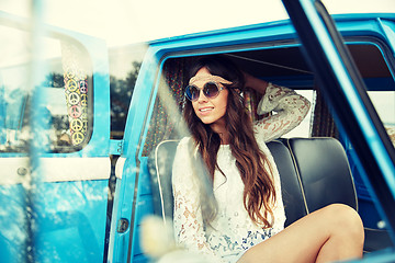 Image showing smiling young hippie woman in minivan car