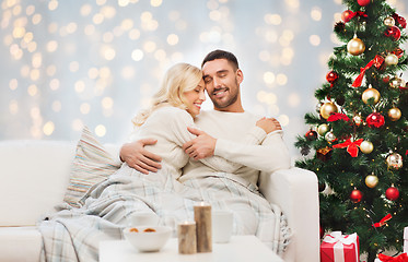 Image showing happy couple hugging over christmas tree