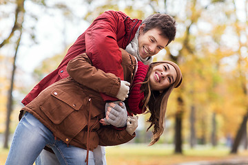 Image showing happy young couple having fun in autumn park