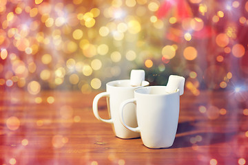 Image showing cups of hot chocolate with marshmallow on wood