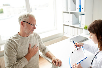 Image showing doctor showing cardiogram to old man at hospital