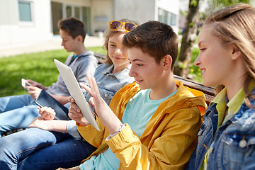 Image showing happy friends with tablet pc computer outdoors