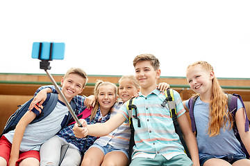 Image showing happy elementary school students taking selfie