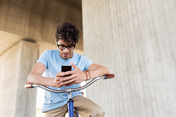 Image showing man with smartphone and fixed gear bike on street