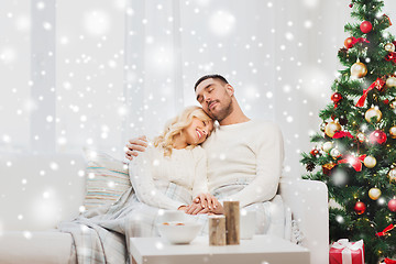 Image showing happy couple at home with christmas tree