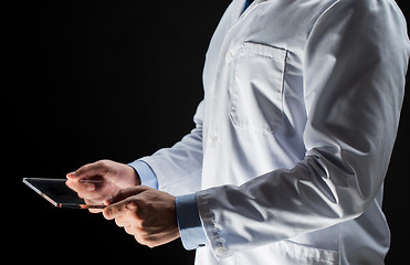 Image showing close up of doctor or scientist with tablet pc