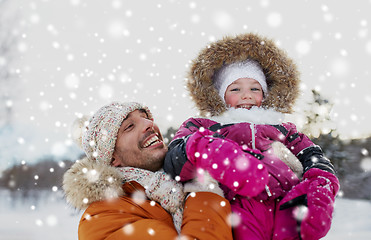 Image showing happy family in winter clothes outdoors