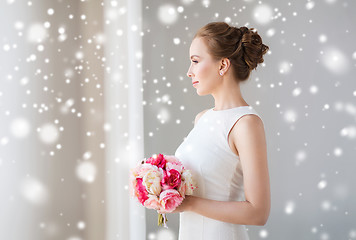 Image showing bride or woman in white dress with flower bunch