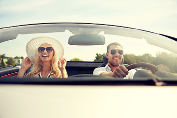 Image showing happy man and woman driving in cabriolet car