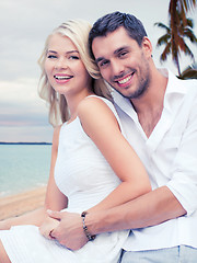 Image showing couple having fun and hugging on beach