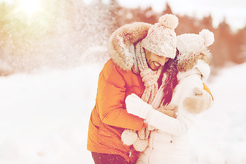 Image showing happy couple hugging and laughing in winter