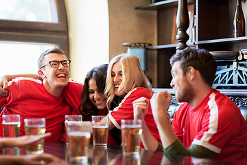 Image showing football fans or friends with beer at sport bar