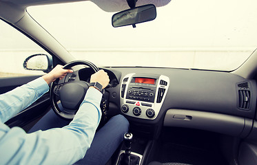 Image showing close up of young man driving car