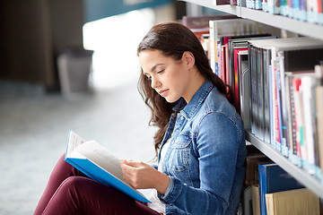 Image showing high school student girl reading book at library