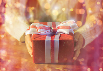 Image showing close up of woman with christmas gift