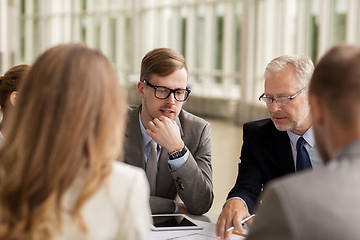 Image showing architects with tablet pc and blueprint at office