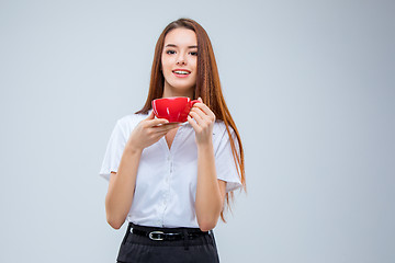 Image showing The young business woman on gray background