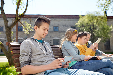 Image showing happy friends with tablet pc computer outdoors