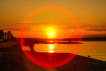 Image showing 	Vivid sunset on lake and round cicrle