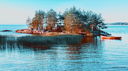 Image showing A Small Remote Island Among The Blue Water of Lake