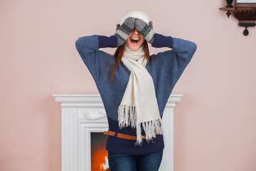 Image showing Girl near fireplace