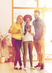 Image showing creative team with tablet pc and coffee at office